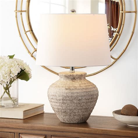 SAFAVIEH's stunning collection of table lamps provides style and function in any living space. . Safavieh lamps